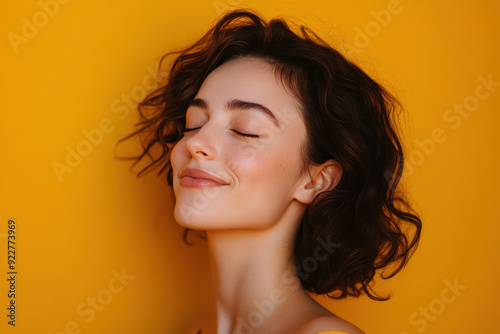 A close up of a woman's face with her eyes closed