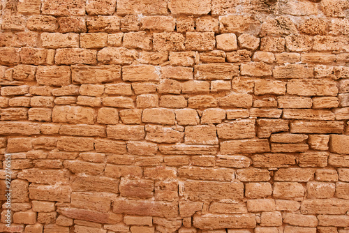 Ancient wall of big yellow stone background