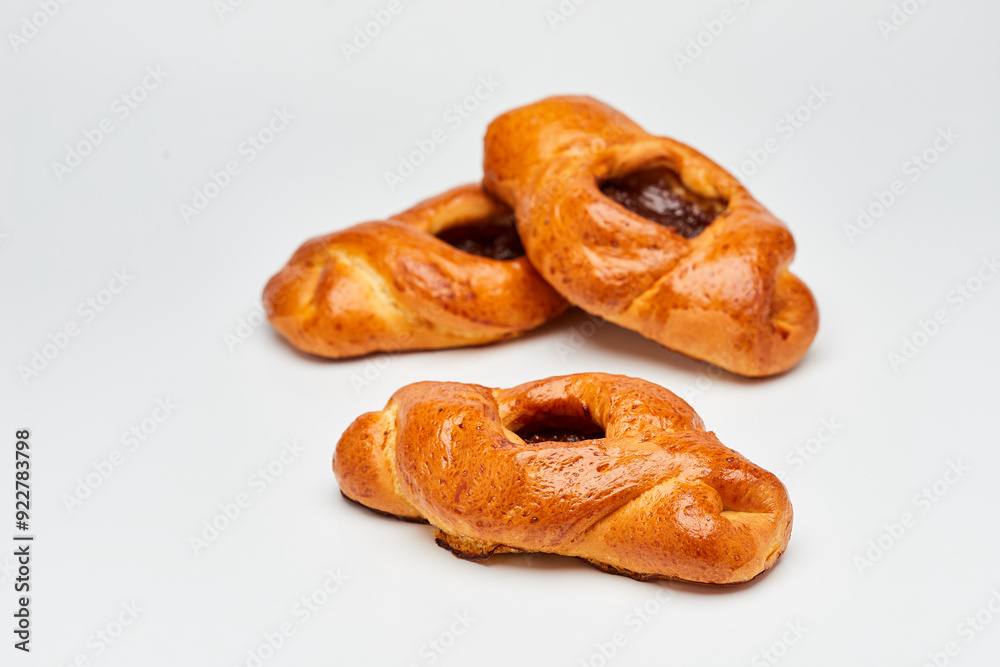 Golden-brown pastries filled with fruit jam, perfect for a delicious breakfast or sweet snack Golden-brown pastries filled with fruit jam, perfect for a delicious breakfast or sweet snack