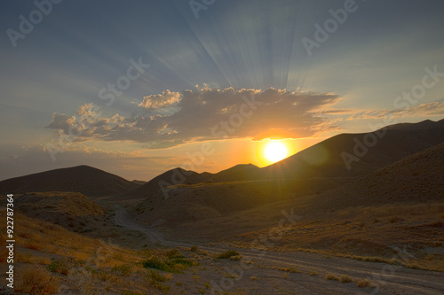 sunset over the mountains #922787364