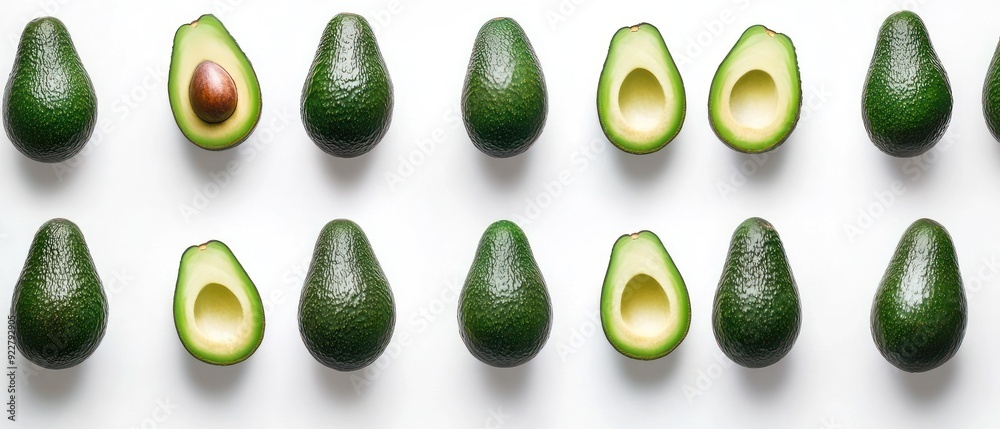 Whole and Half Avocados Arranged in a Row Whole and Half Avocados Arranged in a Row