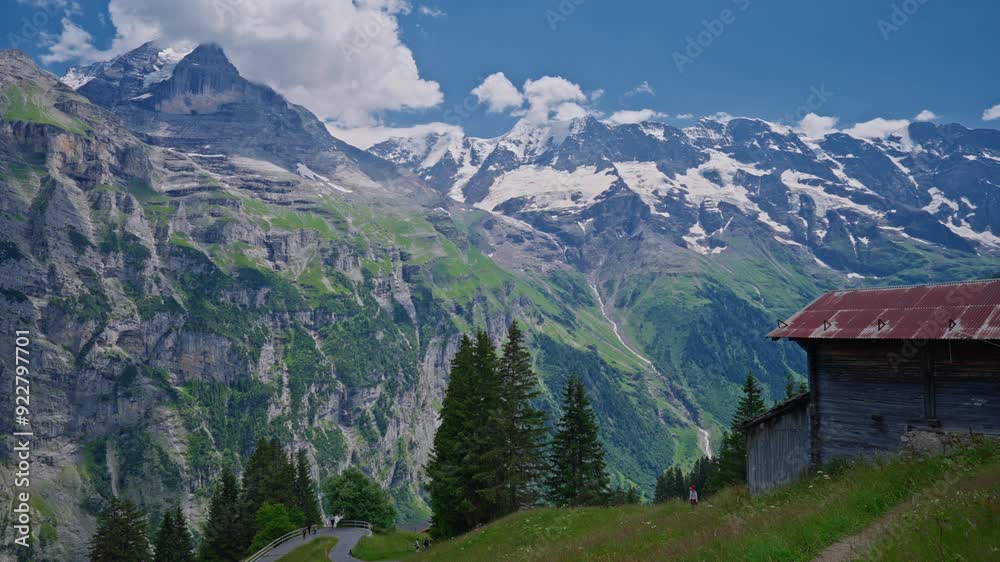Establishing shot of the beautiful Swiss nature and village in Switzerland. Footage of idyllic swiss village sunny day. Wide view of Swiss Alps. Switzerland summer tourism destination Establishing shot of the beautiful Swiss nature and village in Switzerland. Footage of idyllic swiss village sunny day. Wide view of Swiss Alps. Switzerland summer tourism destination