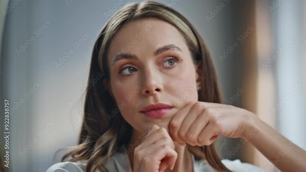 Serious model lymphatic drainage procedures looking mirror closeup. Lady massage Serious model lymphatic drainage procedures looking mirror closeup. Lady massage