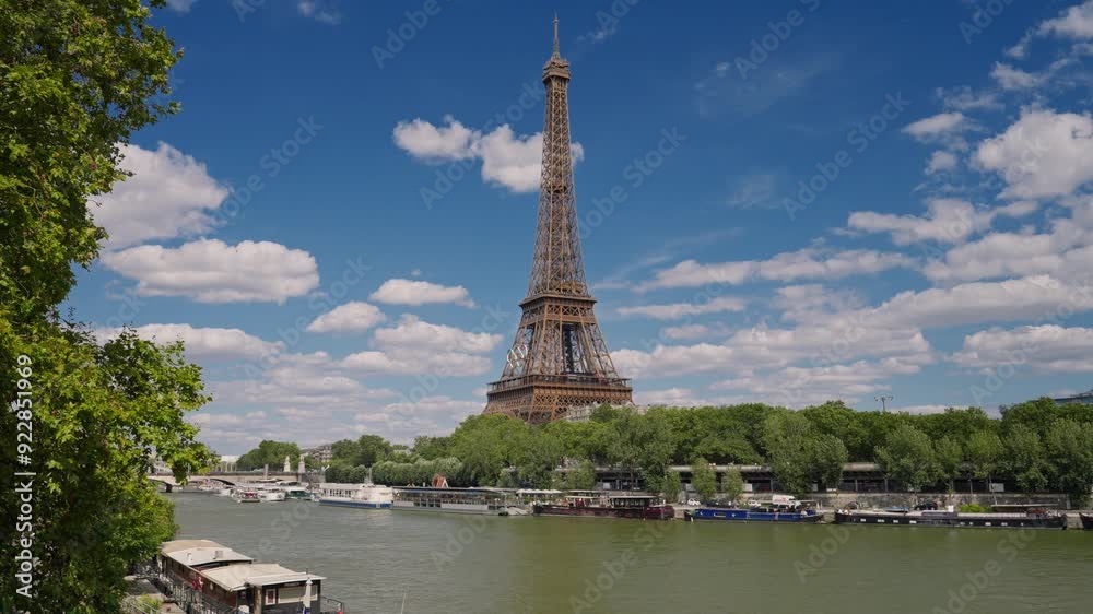 Eiffel tower decorated with Olympic rings for the Olympic games 2024. The Olympic rings installed on the Eiffel Tower with tourists strolling near the Trocadero square