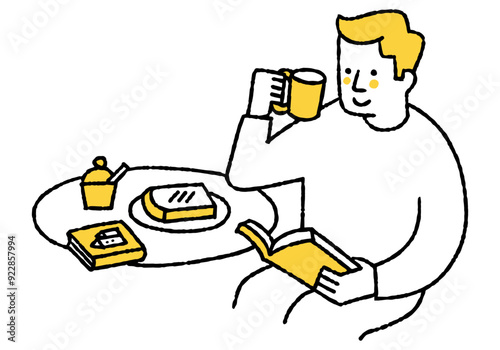 Man reading a book while eating breakfast