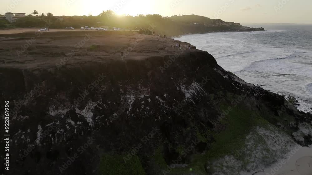 Drone flies over Chapadão toward Praia do Amor and sunset in Pipa, Rio Grande do Norte, Brazil