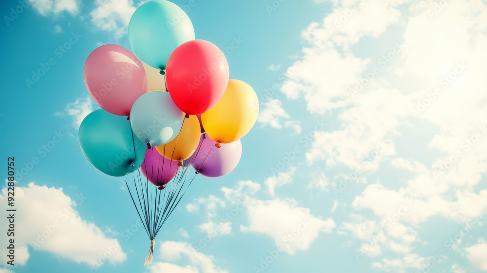 Colorful Balloons Floating in Blue Sky – Joyful Celebration Concept Colorful Balloons Floating in Blue Sky – Joyful Celebration Concept