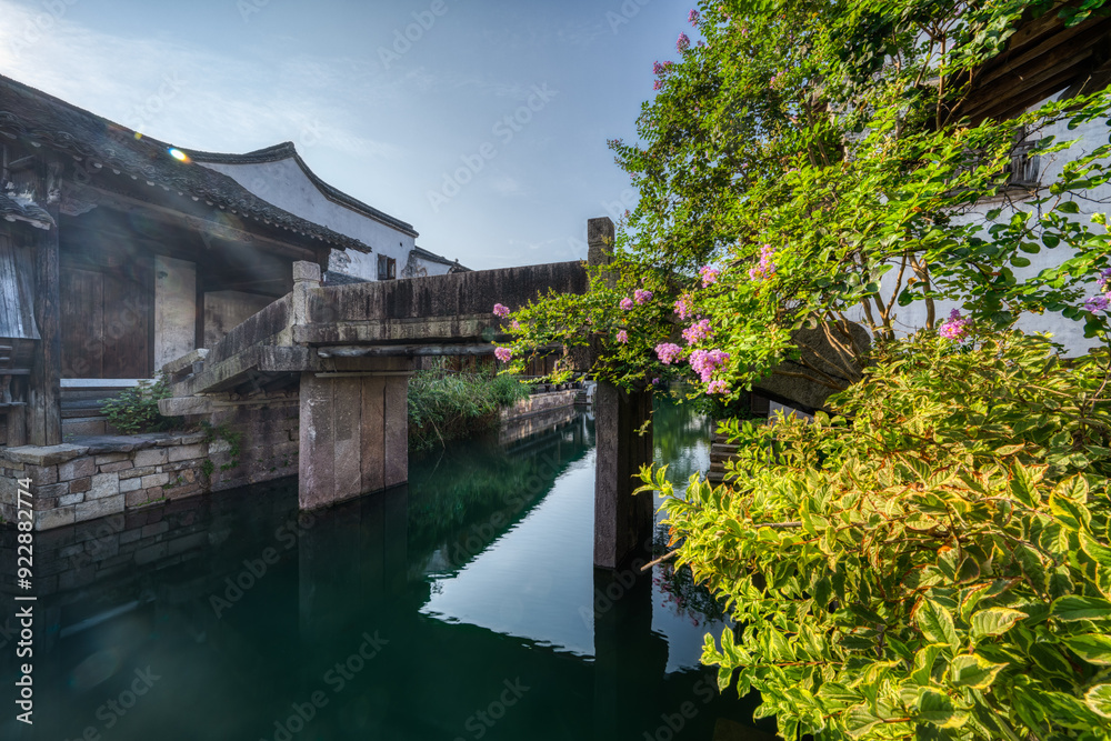 Chinese-style buildings and small bridges by the river. Chinese-style buildings and small bridges by the river.