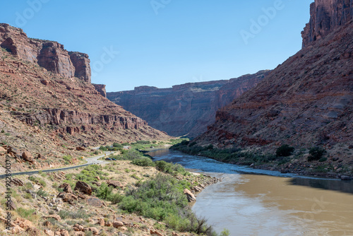 Red rock landscape along Utah State Route 128 near Moab on sunny summer afternoon.