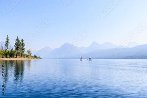 Paddle boarders on Lake McDonald in Glacier National Park