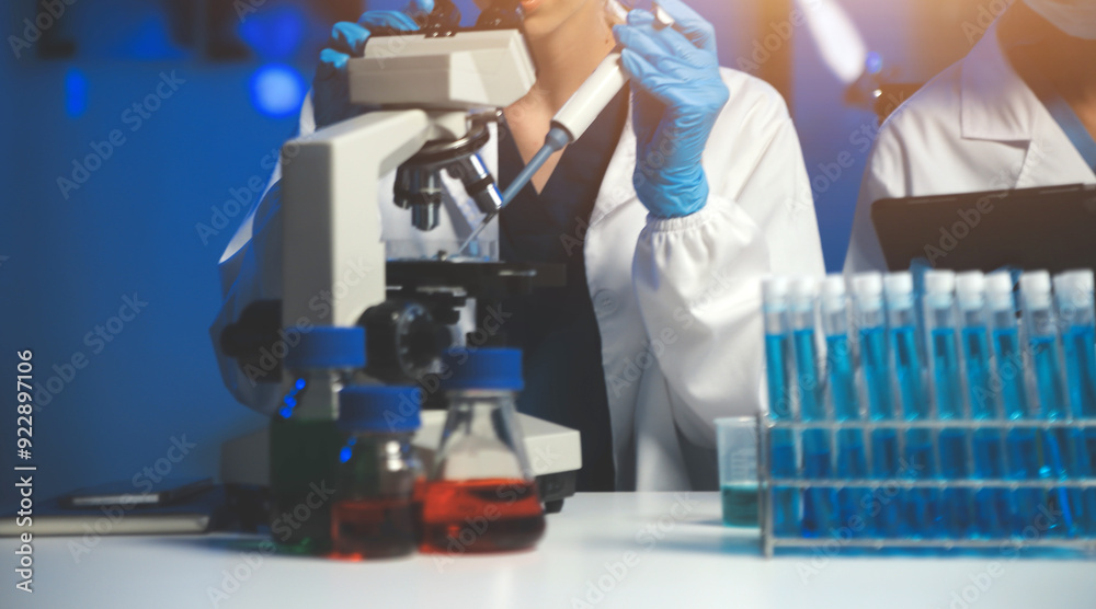 Fototapeta premium professional chemist woman laboratory using scientific microscope for science research, chemistry scientist with microbiology medicals equipment technology to working with medicine biology experiment