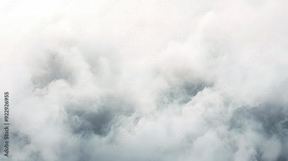 Fototapeta premium Celestial Cotton: A dreamscape of billowing white and grey clouds captured from above, offering a serene and ethereal backdrop. 