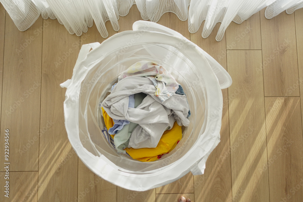 Old clothes thrown into the trash can. Disposal and recycling of clothes. Old clothes thrown into the trash can. Disposal and recycling of clothes.