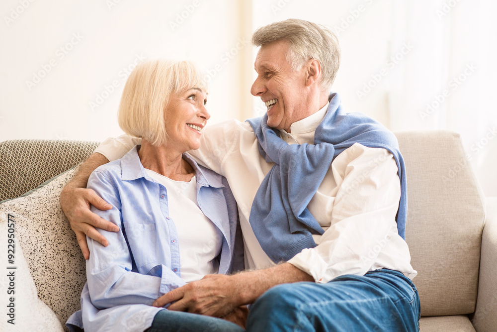 Smiling mature couple looking at each other with affection, enjoying time together Smiling mature couple looking at each other with affection, enjoying time together