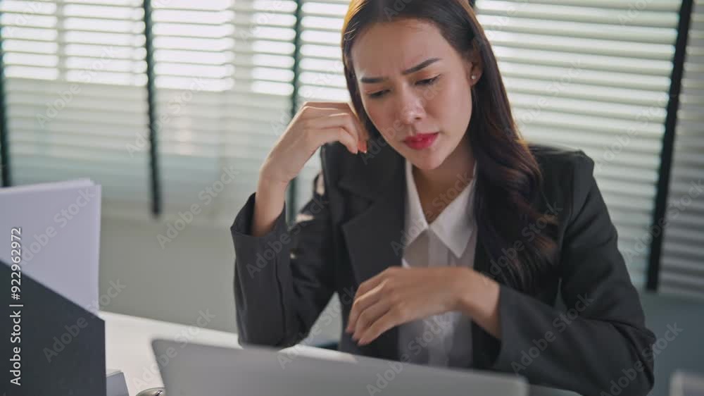 Frustrated Asian young businesswoman overwork late in office workplace. Frustrated Asian young businesswoman overwork late in office workplace.