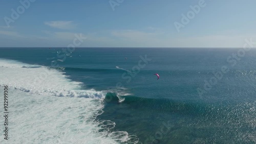 Drone shot of kitesurfer riding the waves of One Eye in Mauritius.
