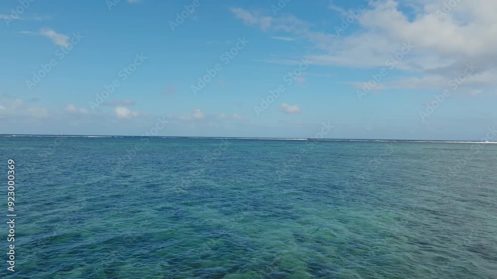 Drone flying from the beach towards the famous wave One Eye in Mauritius. Drone flying from the beach towards the famous wave One Eye in Mauritius.