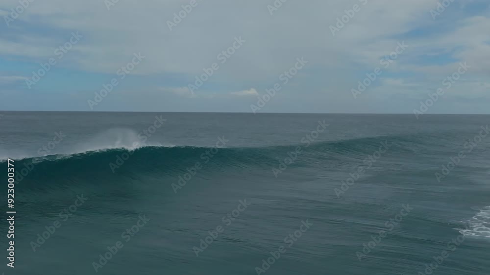 Slow motion drone shot of a wave breaking around the reef in Mauritius. Slow motion drone shot of a wave breaking around the reef in Mauritius.