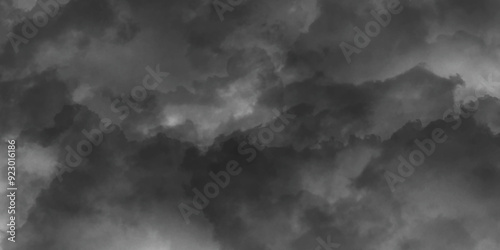 Fluffy stormy clouds in black and white mode storm thunder and tumble across the sky over beautiful natural white clouds, abstract dramatic sky before a storm of gray color black cloud smoke. 