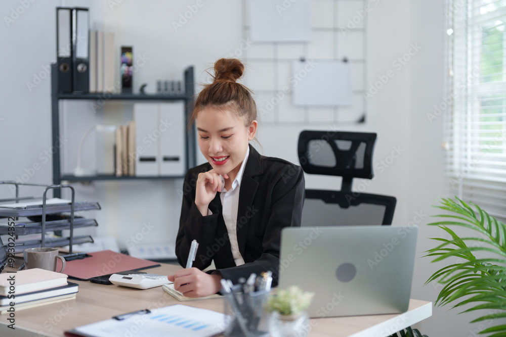 A confident businesswoman in a black suit is sitting at her desk, smiling as she engages in an online meeting, with notes and documents organized on the table in a modern office A confident businesswoman in a black suit is sitting at her desk, smiling as she engages in an online meeting, with notes and documents organized on the table in a modern office