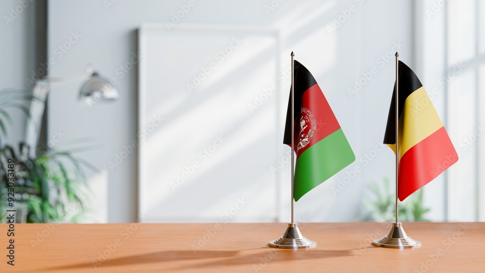 FLAGS OF AFGHANISTAN AND BELGIUM ON TABLE FLAGS OF AFGHANISTAN AND BELGIUM ON TABLE
