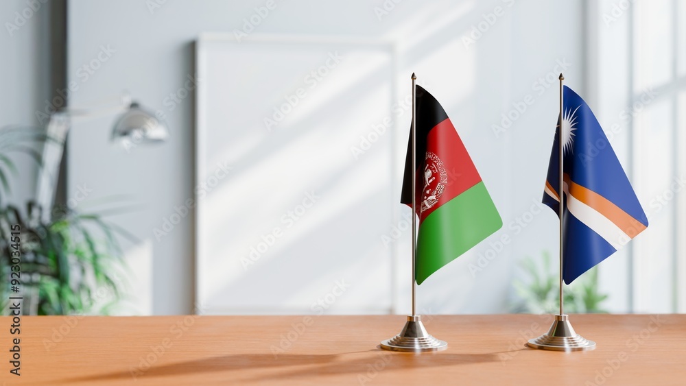 FLAGS OF AFGHANISTAN AND MARSHALL ISLANDS ON TABLE FLAGS OF AFGHANISTAN AND MARSHALL ISLANDS ON TABLE
