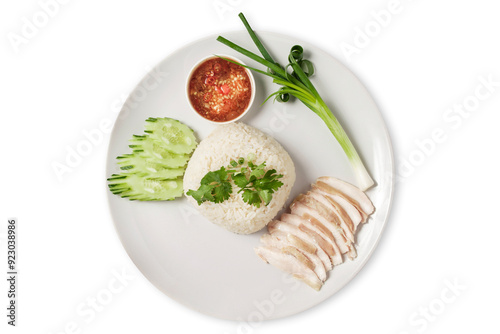 steamed rice topped with chickenwith side dishes such as cucumber, spring onion, fried garlic and dipping sauce is a healthy food. photo