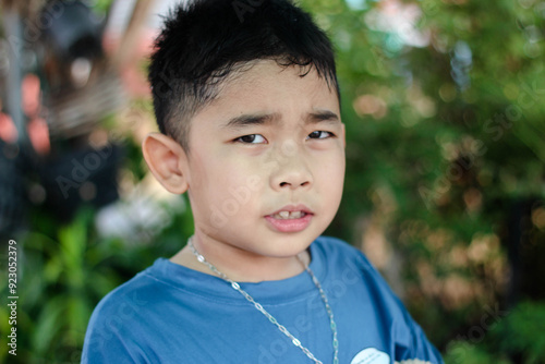 Asian boy has a cute smiling face.