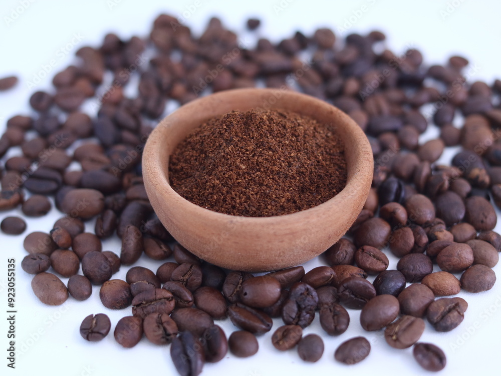 The coffee beans and the ground coffee isolated on white. The coffee beans and the ground coffee isolated on white.