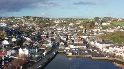 A cinematic aerial revealing the quaint town of Kinsale, Ireland showcasing it's harbour and the River Brandon photo