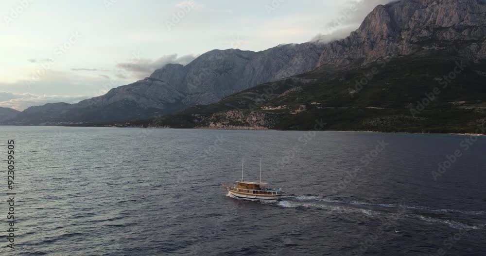 Tracking Aerial Shot Of A Boat In The Adriatic Sea On The Coastline Of Makarska In Croatia. Tracking Aerial Shot Of A Boat In The Adriatic Sea On The Coastline Of Makarska In Croatia.