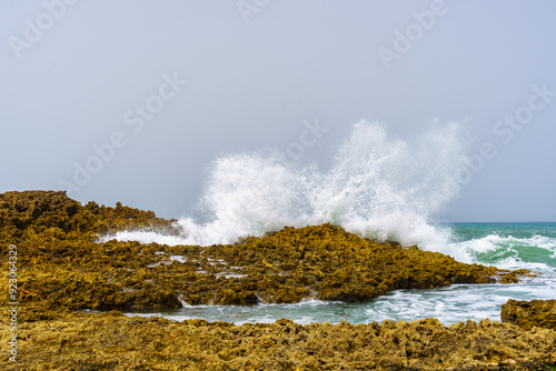 Obraz na płótnie Waves crashing on the rocky beach, village resort Oualidia w salonie
