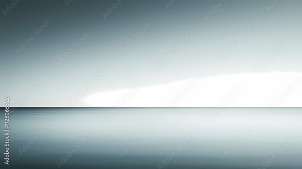 A minimal horizon of blue sky and calm ocean water.