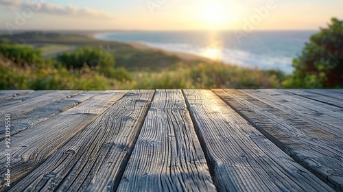 Sunset view from a wooden deck overlooking the ocean and coastline in a coastal landscape