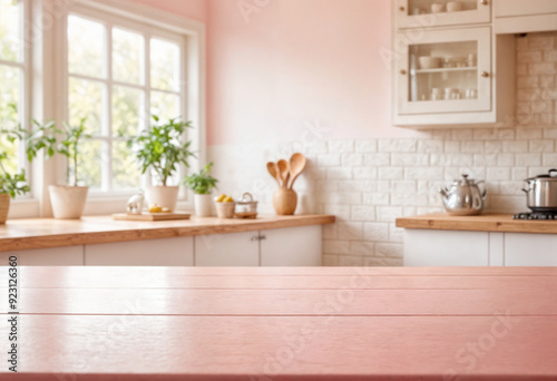 Green Empty wooden table with the bright white interior of the kitchen as a blurred background behind the bokeh golden sunshine