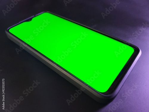 Green screen phone for mockup. Light background.