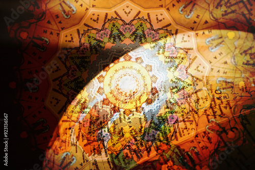 Abstract image of a globe with the sun's rays in the background