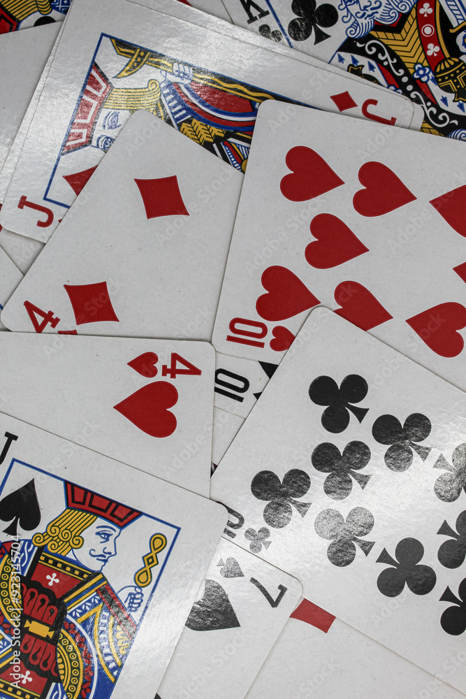 selective focus stack of playing cards or gambling or poker cards scattered or strewn, suitable for wallpaper selective focus stack of playing cards or gambling or poker cards scattered or strewn, suitable for wallpaper