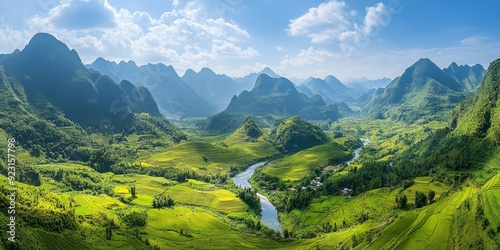 A stunning valley view with terraced fields stretching out in the foreground, surrounded by towering mountains and a serene river winding through the lush landscape