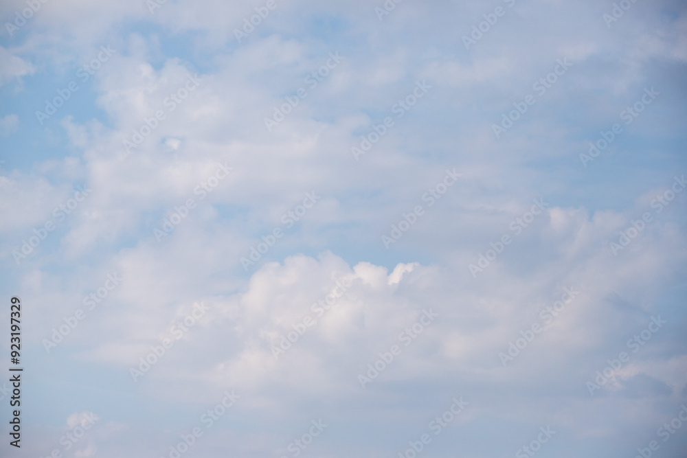 Sky background with clouds. White clouds against a blue sky. Sky background with clouds. White clouds against a blue sky.