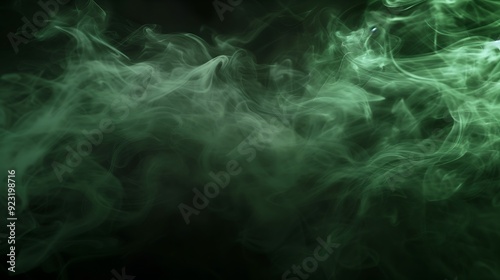 Abstract green smoke in a dark background.