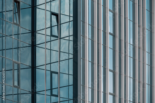 Wallpaper Mural empty glass windows of a modern building with a reflection of the sky in the glass Torontodigital.ca