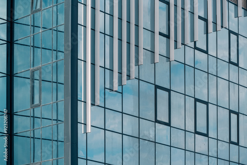 Wallpaper Mural empty glass windows of a modern building with a reflection of the sky in the glass Torontodigital.ca
