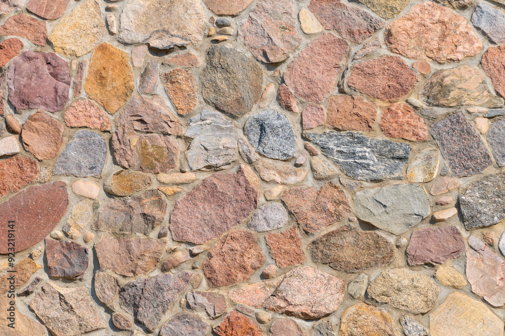 Beautiful stone wall with multi-colored stones. Stone chip. Beautiful stone wall with multi-colored stones. Stone chip.