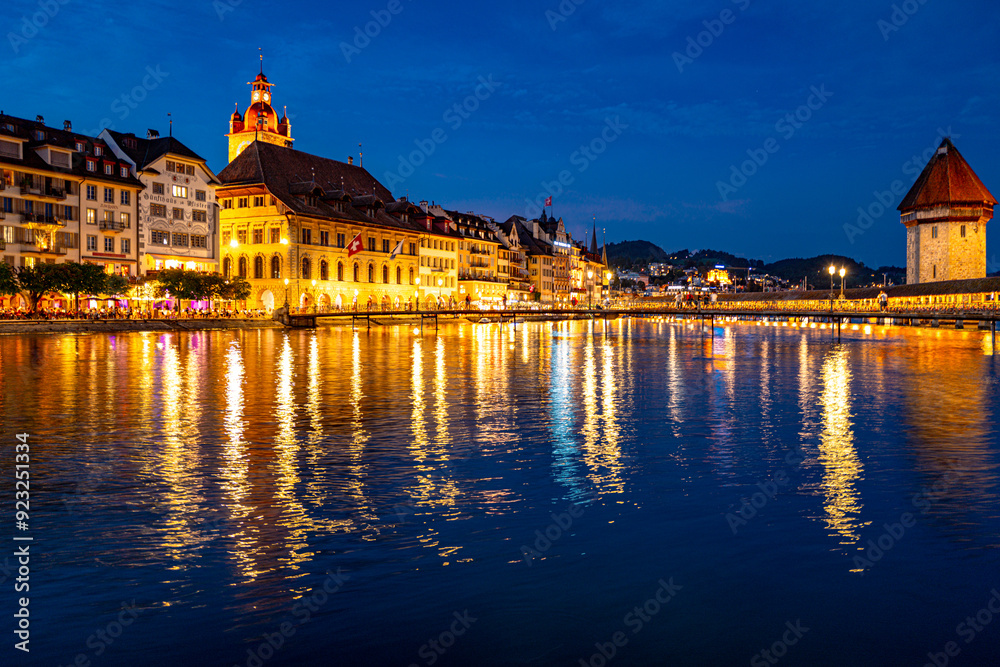 Fototapeta premium Lucern city with famous Chapel Bridge. Lucerne city view. Canton of Lucerne. Lucern Switzerland. Sunrise in historic city center of Lucerne with famous Chapel Bridge and lake Lucerne.