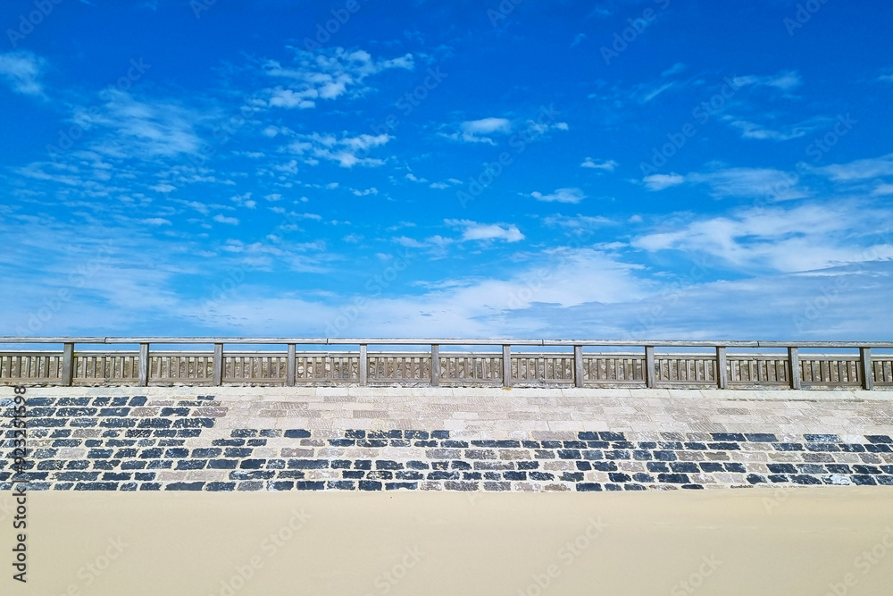 Scenic Seaside Promenade with Blue Sky - Ideal for Travel Posters and Vacation Designs Scenic Seaside Promenade with Blue Sky - Ideal for Travel Posters and Vacation Designs