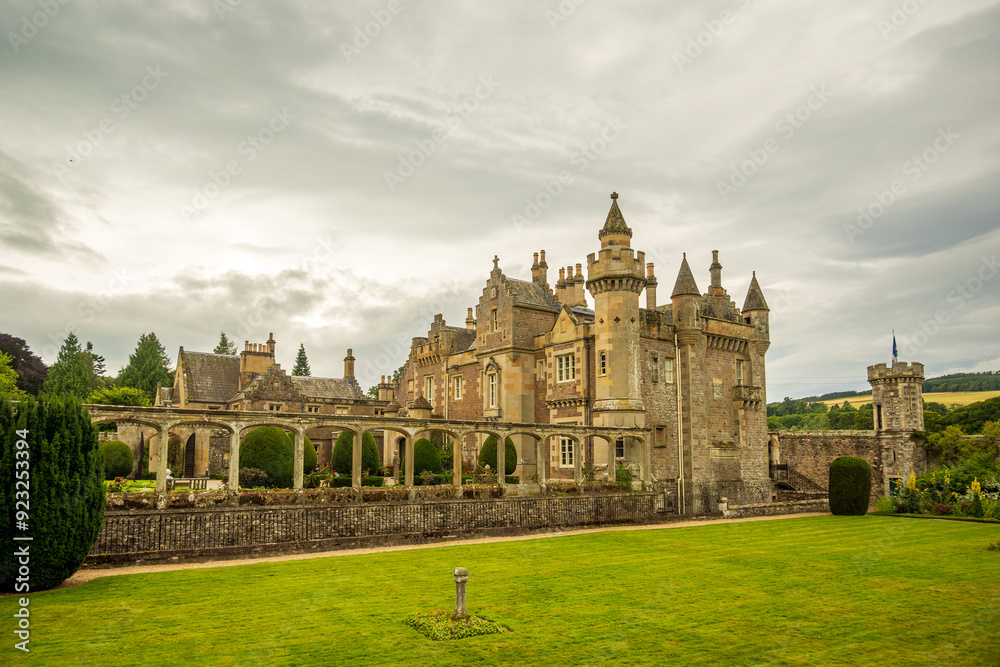 Fototapeta premium romantic castle house and garden with lawn and sky shot in abbotsford in the scottish borders room for text