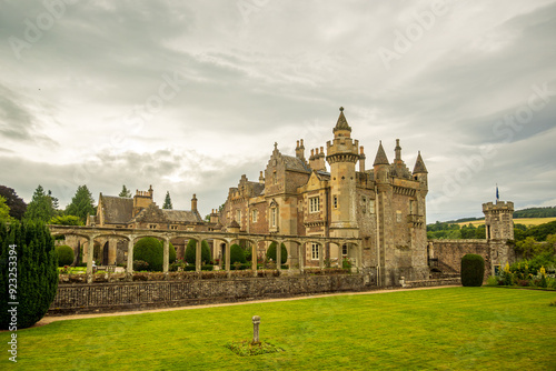 romantic castle house and garden with lawn and sky shot in abbotsford in the scottish borders room for text photo