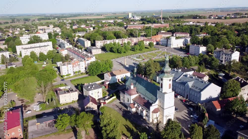 Saint Thomas the Apostle Church and the surrounding Kietrz town center with greenery and buildings. Kietrz, Poland Saint Thomas the Apostle Church and the surrounding Kietrz town center with greenery and buildings. Kietrz, Poland