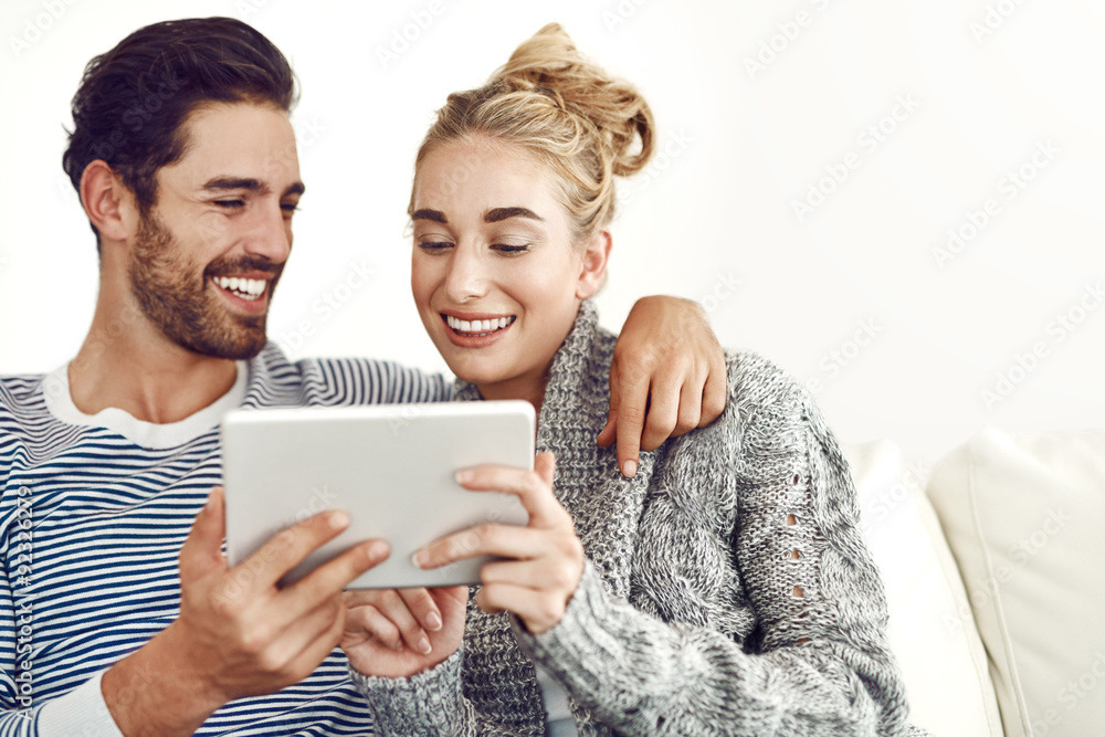 Happy couple, love or tablet for movie, news and streaming online on couch in living room. Technology, internet or people in lounge on social network app on digital website or touchscreen in home Happy couple, love or tablet for movie, news and streaming online on couch in living room. Technology, internet or people in lounge on social network app on digital website or touchscreen in home